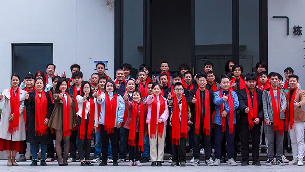 A Group Photo of DT 3D Printing Factory Worker Team in Front of the Factory Building