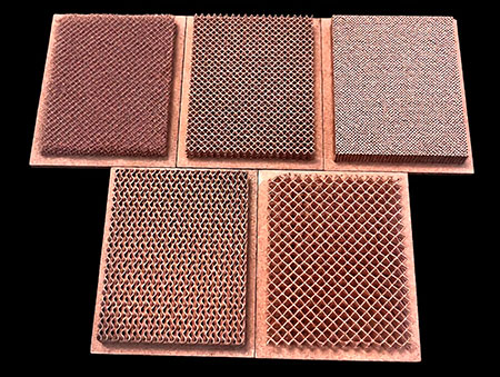 Assorted SLM 3D printed pure copper lattice heat sink samples with different lattice unit cell topologies